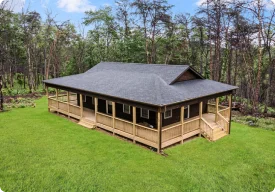Rustic The Cozy Retreat custom home with warm wood tones and inviting design by Beiler & Co.